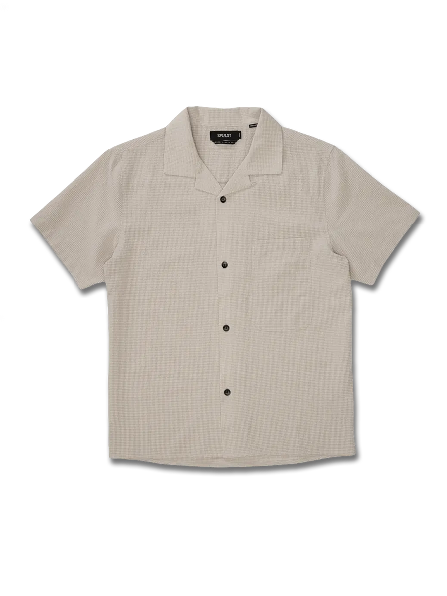 Beige short-sleeve shirt on a white background